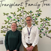 Liver-intestinal transplant patient Clare with Professor Adam Testro, Director of Liver and Intestinal Transplant Medicine, in front of the Transplant Family Tree on Ward 8 West.
